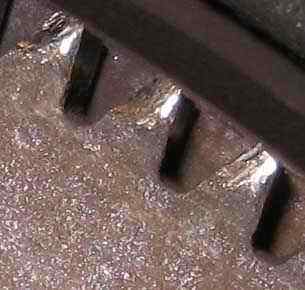 Flywheel teeth damaged by pinion