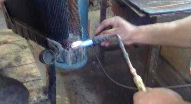 Mercedes Benz Truck radiator fixing a leak by rsoldering a joint